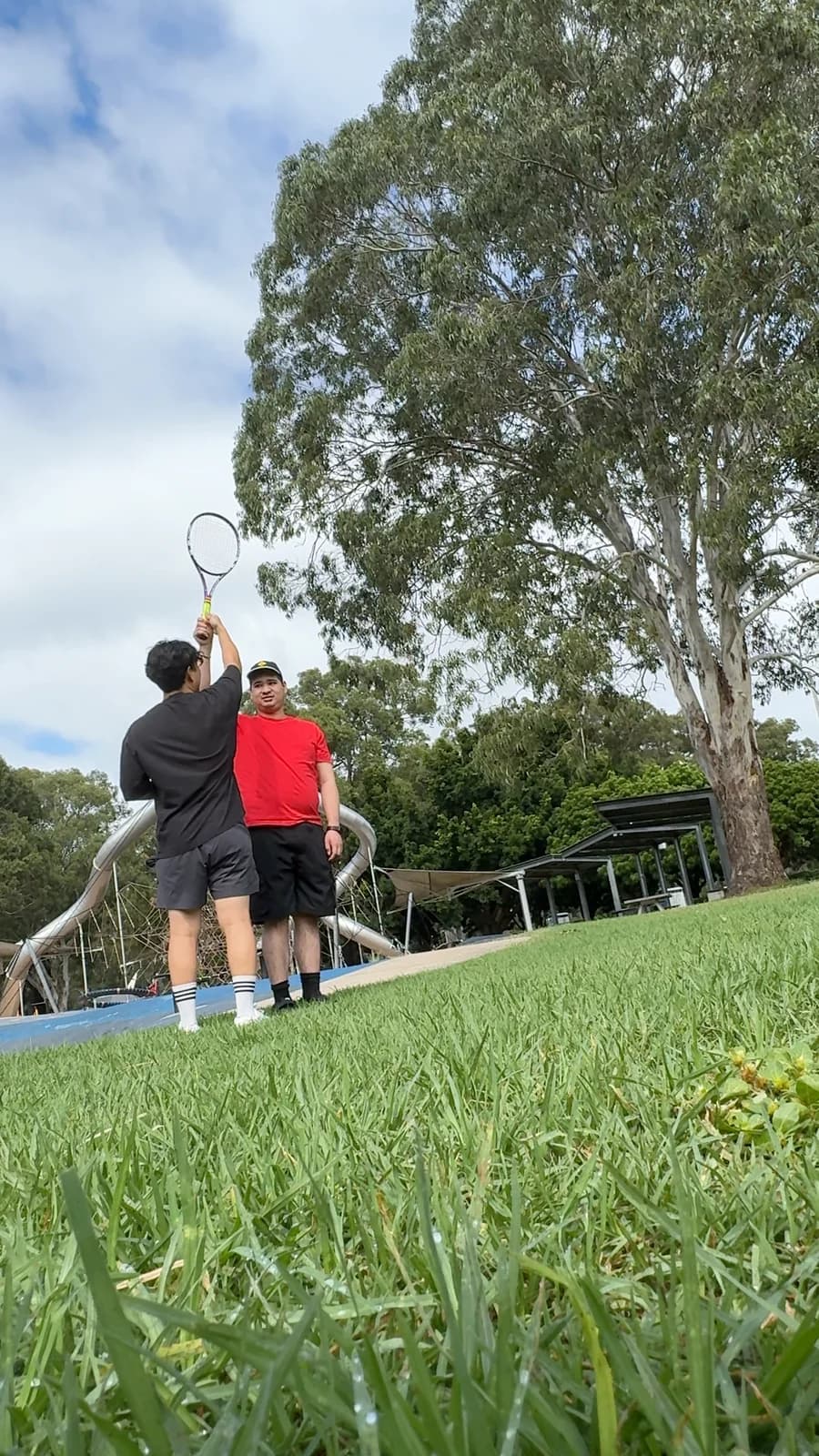 Drift Health participant playing badminton outdoors with his exercise physiologist