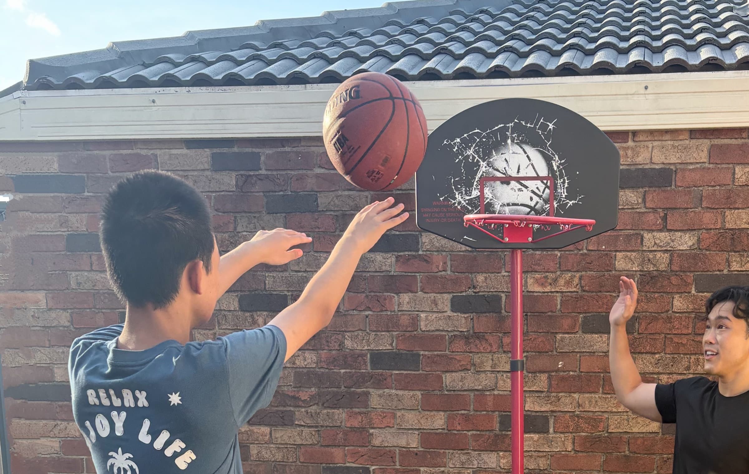 A participant practising basketball shots with a Drift Health practitioner