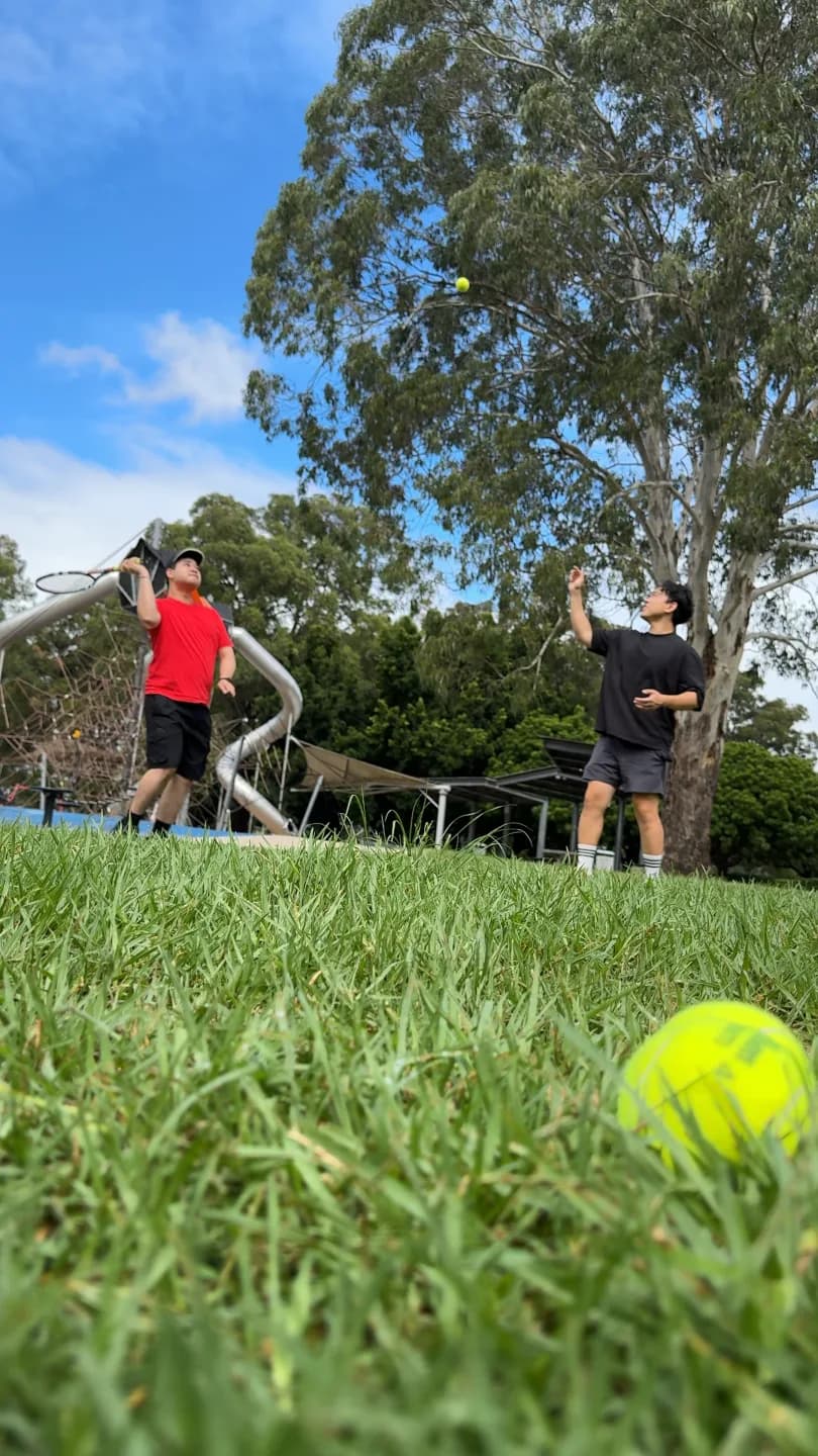 A participant and Drift Health therapist practising tennis in a local park