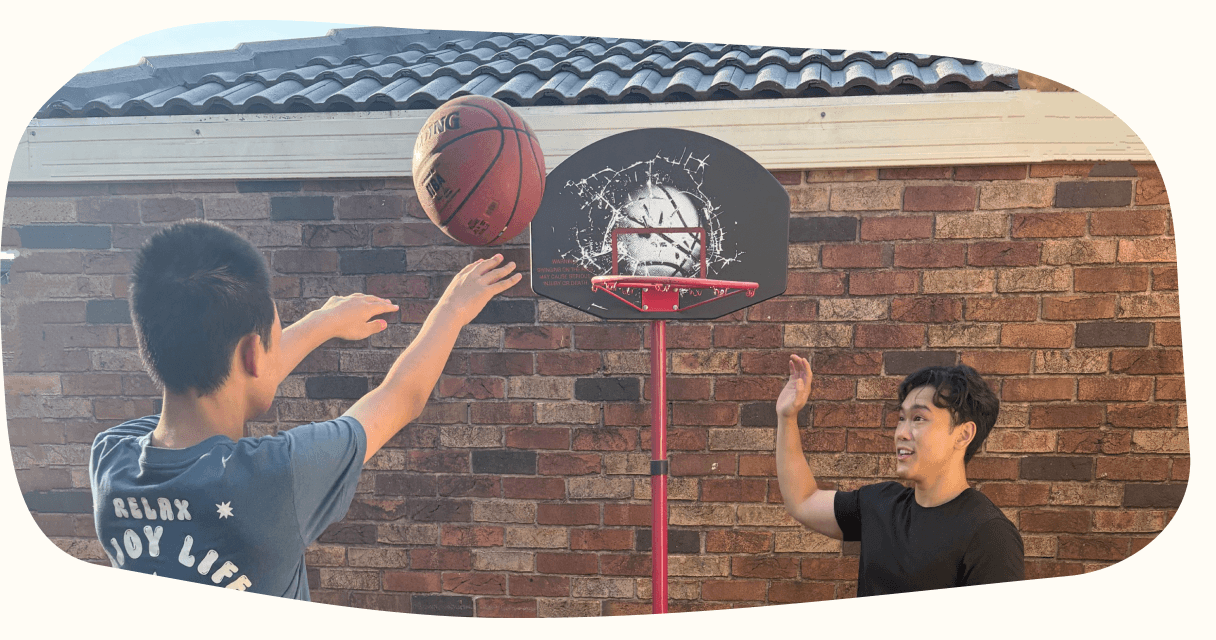 A participant practising basketball during a play-based session