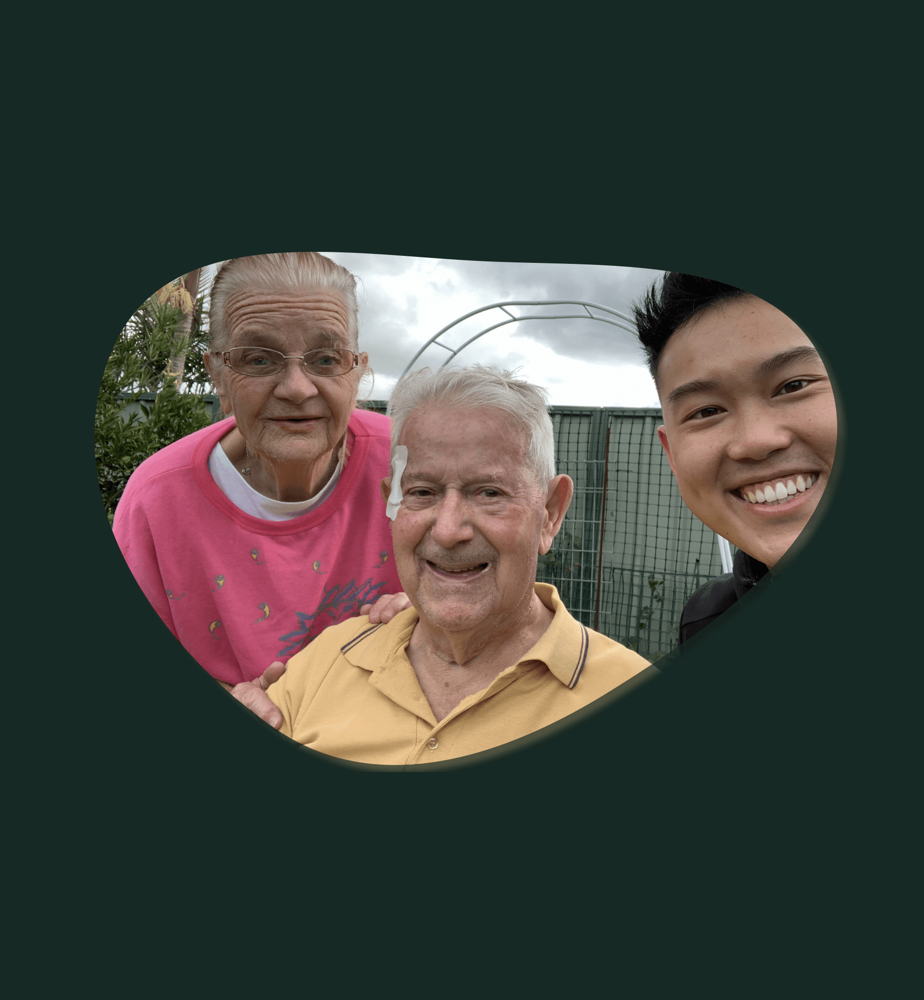 Victor with two older adults outdoors